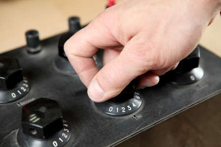 Electrician engineer work tester measuring voltage and current of power electric line in electical...