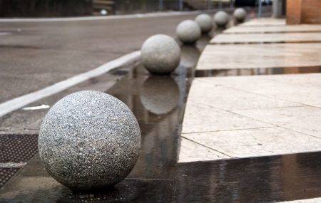 wet granite balls on the roadの写真素材