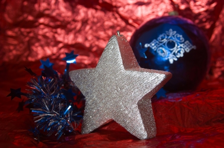 Christmas star candle with a blue ballの写真素材