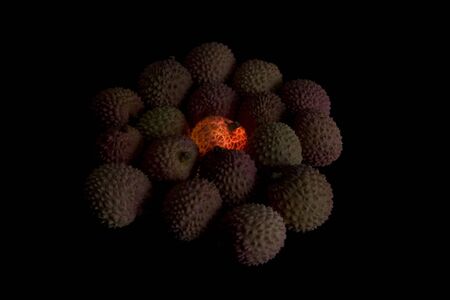 Lychee's,one lit from underneath,Slightly underexposed for effect