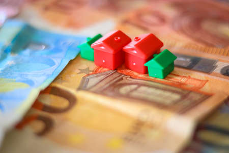 House model and euro banknotes. Real estate concept. Selective focus.