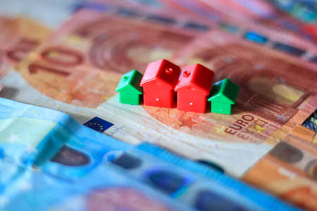 House model on a background of euro banknotes. The concept of real estate and savings.の写真素材