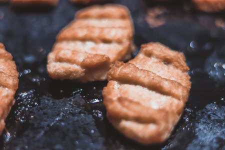 Crispy chicken nuggets in an ovenの写真素材