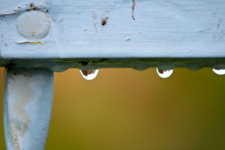 Raindrops Slooping From Rusty Painted Object
