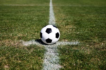 Photo Of A Soccer Ball On The Centre Point Of The Stadium