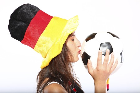German Soccer Fan Girl With Hat Kissing The Ballの写真素材