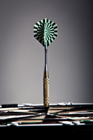 Vertical View Of An Arrow That Hit The Darts Board Center の写真素材