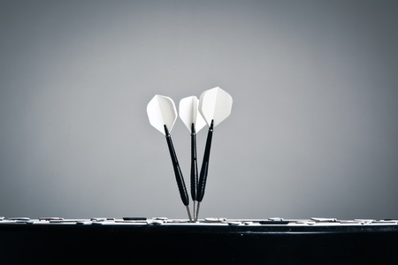Perspective View Of Three Arrows In The Center Of Darts Boardの写真素材