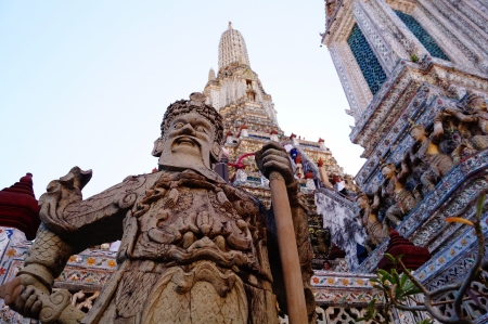 Giant and angle with pagoda in Thailandの写真素材