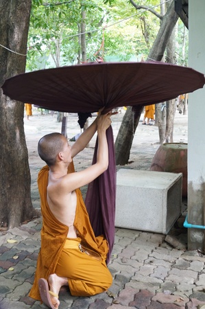 Buddhist monk and big umbrellaのeditorial素材