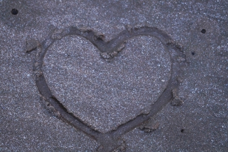 heart drawing on beachの写真素材