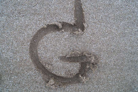 G letter on beach         の写真素材