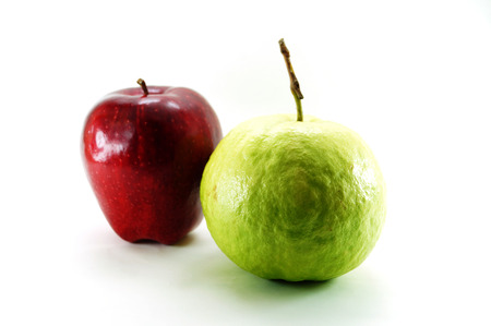 Red ripe apple and guava on white backgroundの写真素材