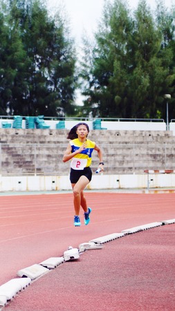 Athletic  running on trackのeditorial素材