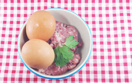 minced pork on pink dot backgroundの写真素材