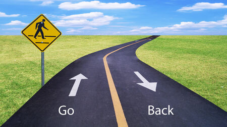 Teamwork and partnerships connecting on the same path as a team sharing the same strategy and vision for the success of a company by working together merging as one with a blank green highway sign.の写真素材