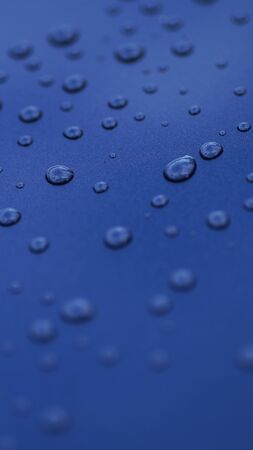 drop of water on blue glassの写真素材