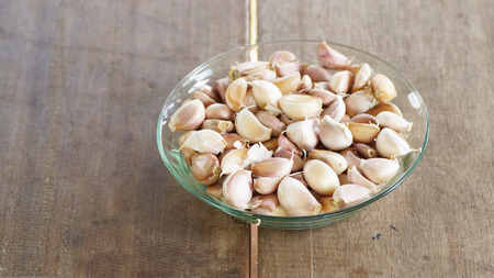 onion on wood backgroundの写真素材