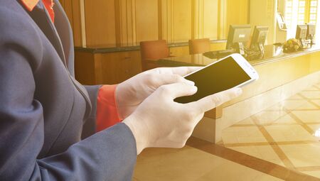 Woman with modern mobile phone in handsのeditorial素材