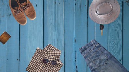 hipster clothes and accessories of man, on a wooden background in vintage style from top viewの写真素材