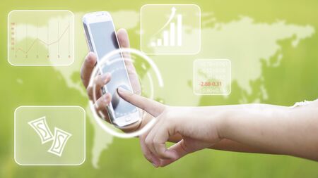 hand touch on screen of phone , concept in technology of business, money, stock market online