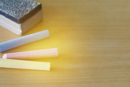 chalk and eraser on tableの写真素材