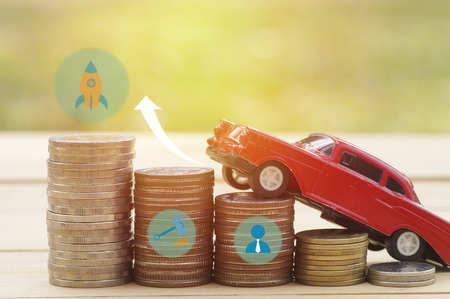 red car on pile of coins, concept in business, finance and loan in vehicle