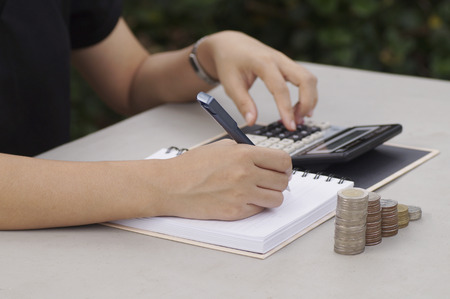 hand, financial, pile, stack, finance, business, desk, writing, tax, office, accounting, calculating, report, paper, money, banking, calculator, coin, close-up, growth, pen, budget, accountant, businessman, closeup, working, bank, cost, counting, coins, wの写真素材