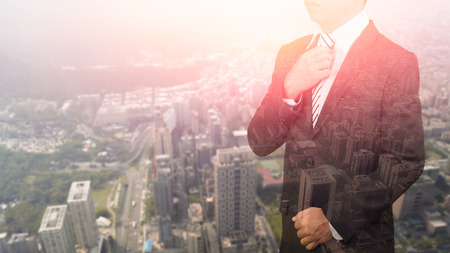 double exposure businessman standing smart and handsomeの写真素材