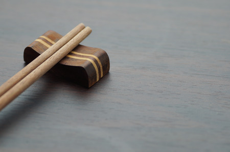 close up chopsticks on wood table and copy spaceの写真素材