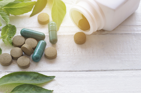 herb pill on top view of wood table and copy spaceの写真素材