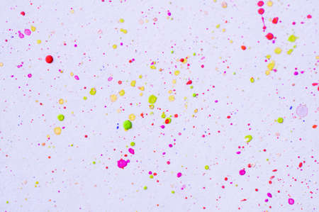 splash of watercolor in many color, pink, yellow, blue, purple and blue- concept in abstract paint paper background for artworkの写真素材