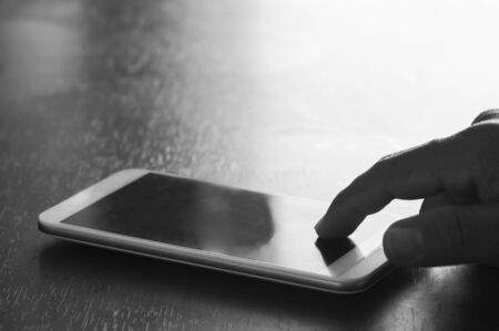 hand touch phone in black and white