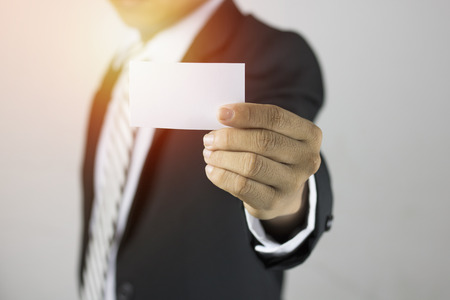 businessman show white paper and sing, copy spaceの写真素材