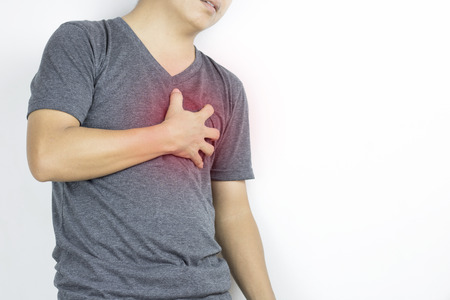 Man, guy has heartache in gray clothe and  hand touch with pain