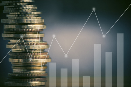 Stacked of coin money with account book finance and banking concept for background.concept in grow and walk step by step for success in businessの写真素材