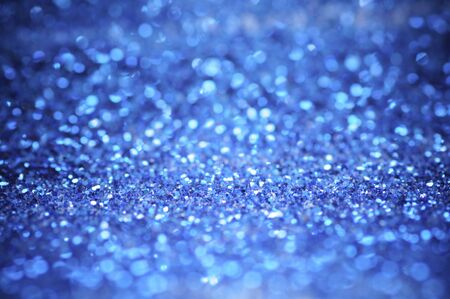 defocus of glitter vintage lights background. blue,white and black for Christmas and new year background.の写真素材