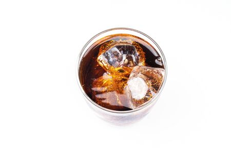 Top view of cold drinking, soda with ice, glass of cola for hot and summer drink isolated on white backgroundの写真素材