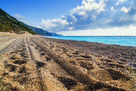 Exotic tropical beach with car tracks  の写真素材