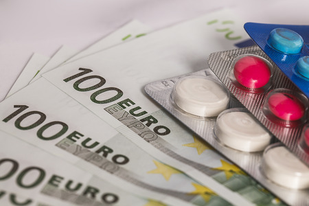 medicine tablets on money の写真素材