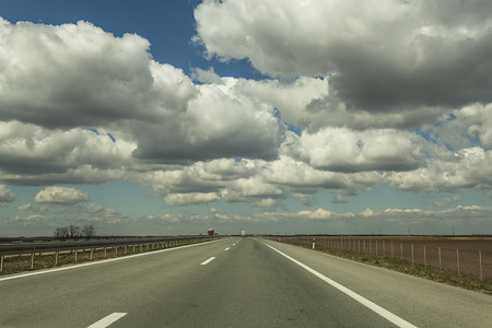Highway Under Cloudy Sky