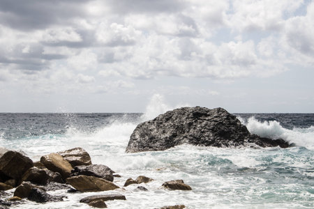 Liguria Rocky Cliff on rough seaの写真素材