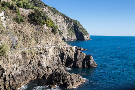 Cinque Terre Riomaggiore Coast on blue sea