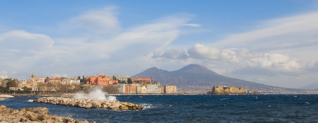 The Castel dell'Ovo (castle of the egg) and vesuvius in Naples Italyの写真素材