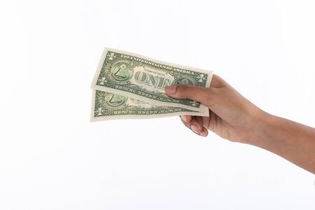 Hand of woman holding dollar banknotes, money, cash,  studio light shooting isolated on white...