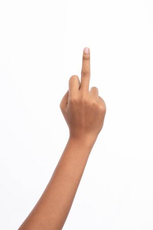 Hand of woman show middle finger, studio light shooting isolated on white backgroundの写真素材