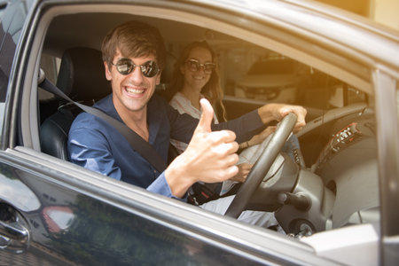 Young caucasian man and woman are couples show travel voucher, plane tickets, smile and looking at...
