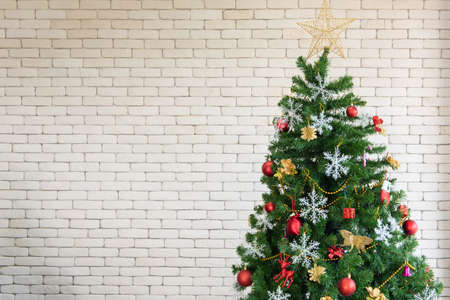 Christmas tree on white wall white copy spaceの写真素材