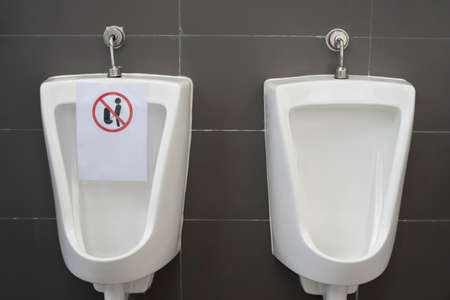 Signs Social Distancing on Urine protection for coronavirus, COVID-19 conceptの写真素材