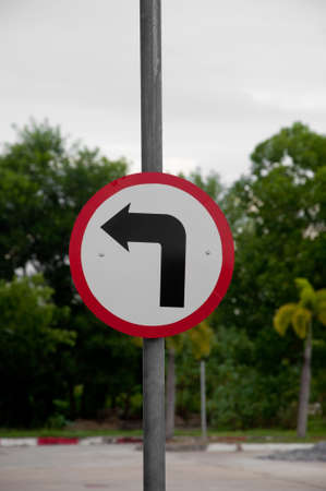 turn left round traffic sign